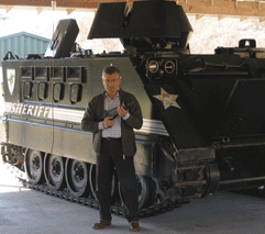 At the Shot Show close to a National Guard tank
