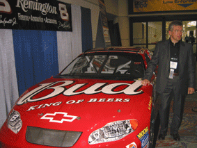 At ShotShow close to a NASCAR car